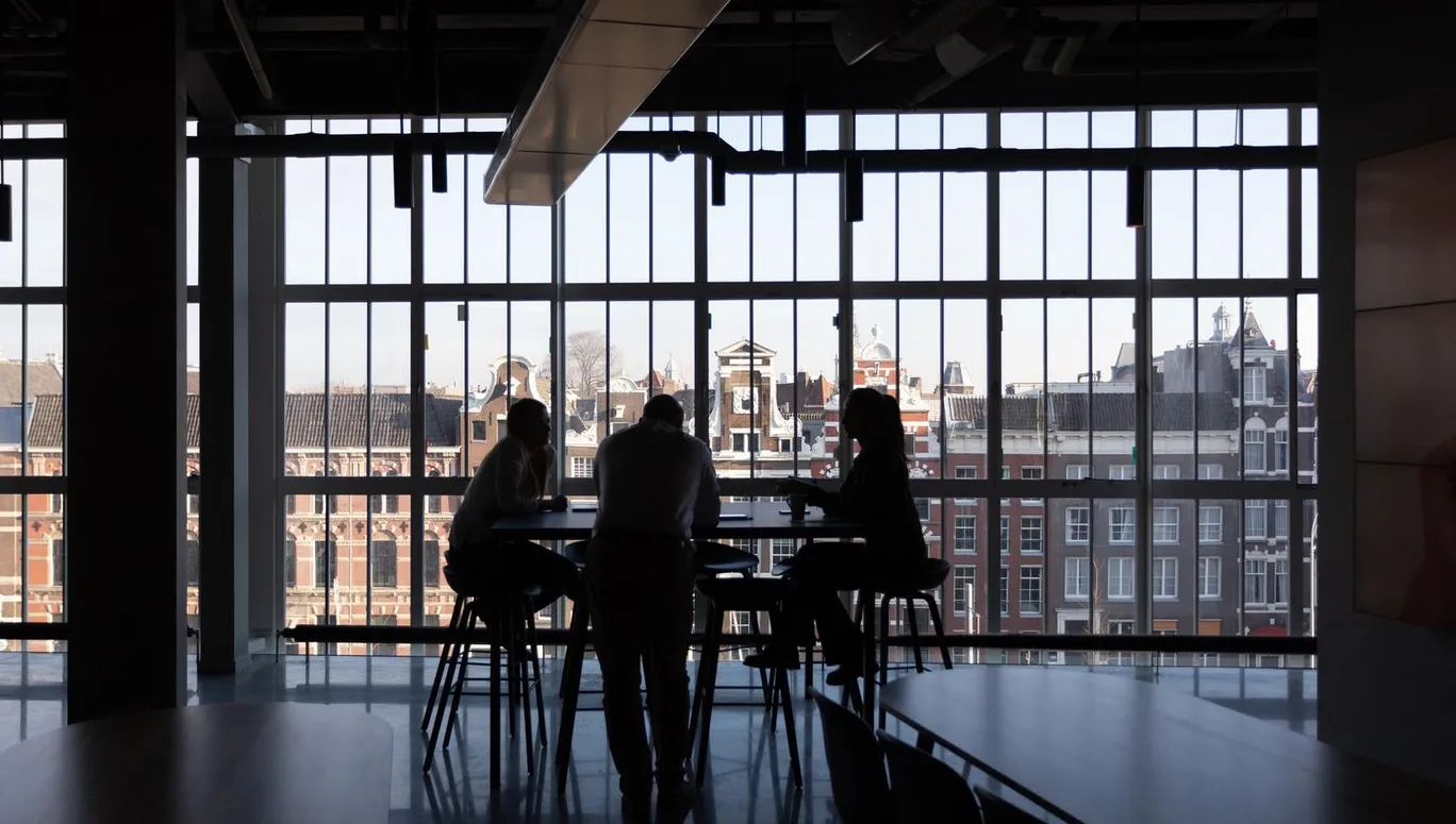 People at table in city centre office