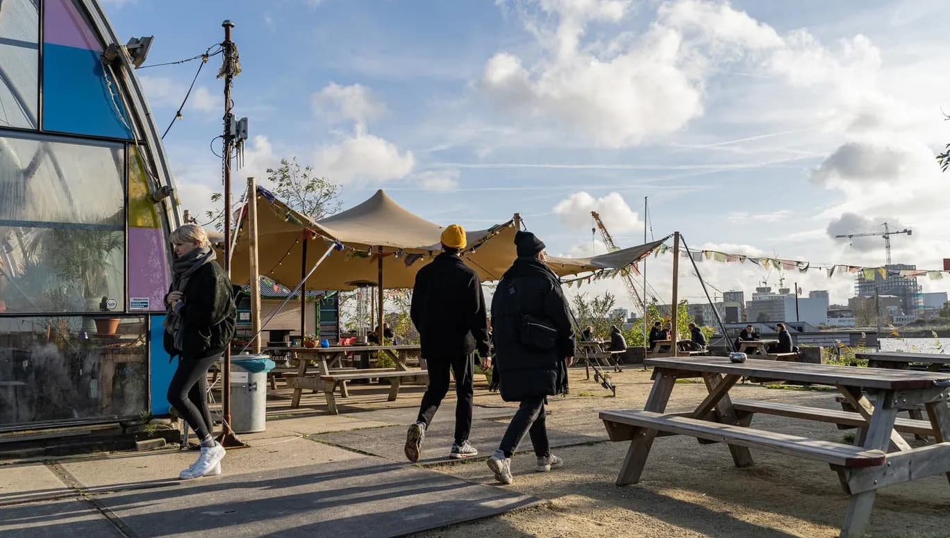 A couple is walking onto the terrace of café-restaurant and cultural hotspot Noorderlicht at NDSM.