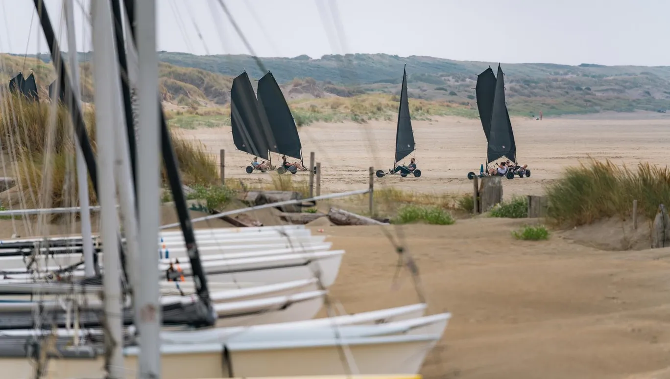 Boats in the sand and blowcarters at IJmuiderslag beach.