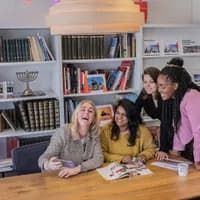 Colleagues working and  reading in the meeting room