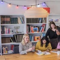 Colleagues working and  reading in the meeting room