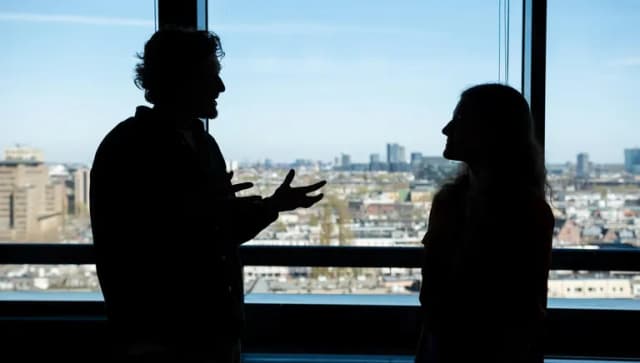 Man and woman discussing business.