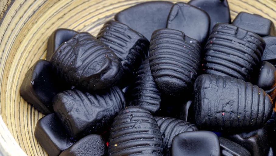 Selective focus of drop typical Dutch black candy, Liquorice is a confection usually flavoured and coloured black with the extract of the roots of the liquorice plant Glycyrrhiza glabra.
1677422320
Typically Dutch foods