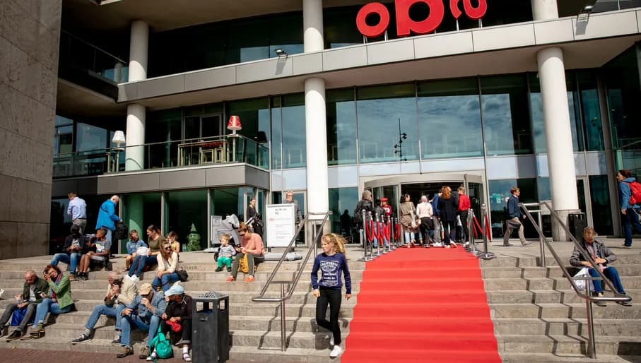 people sitting outside OBA public library
people walking in and out of OBA