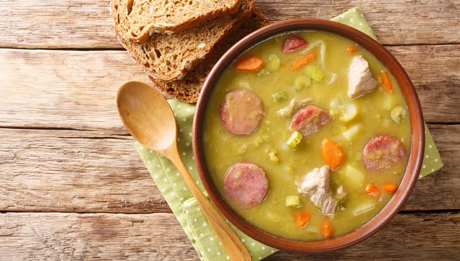 Classic Dutch pea soup erwtensoep, snert closeup in the plate on the table. horizontal top view from above
1873721881
Typically Dutch foods