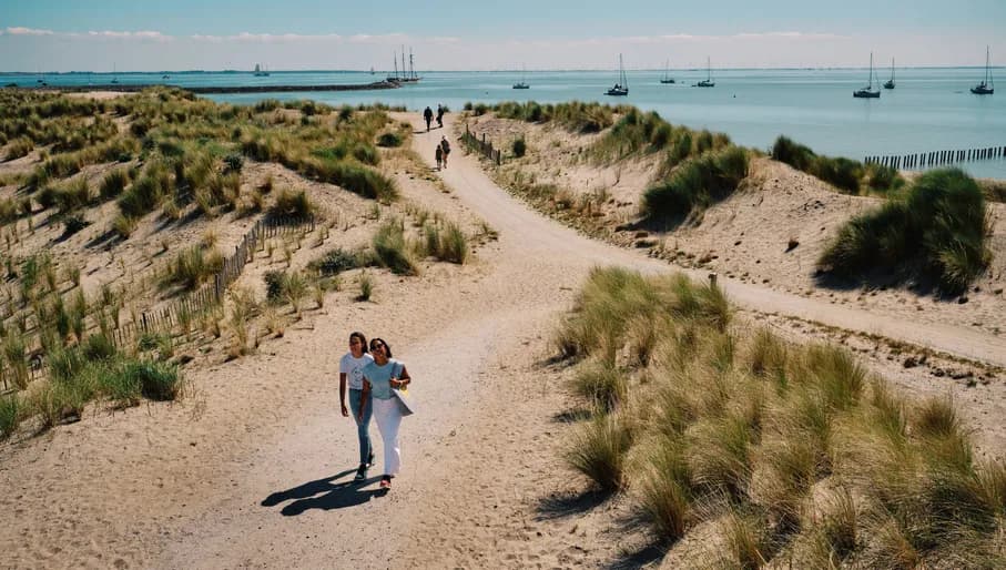 Women walking over one of the Marker Wadden islands.