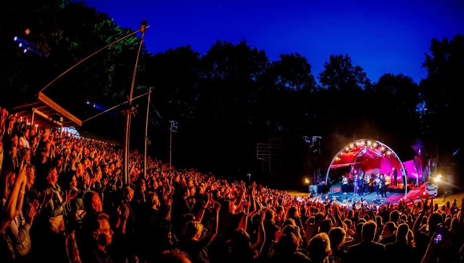Amsterdamse Bos Theater audience watching a performance at night