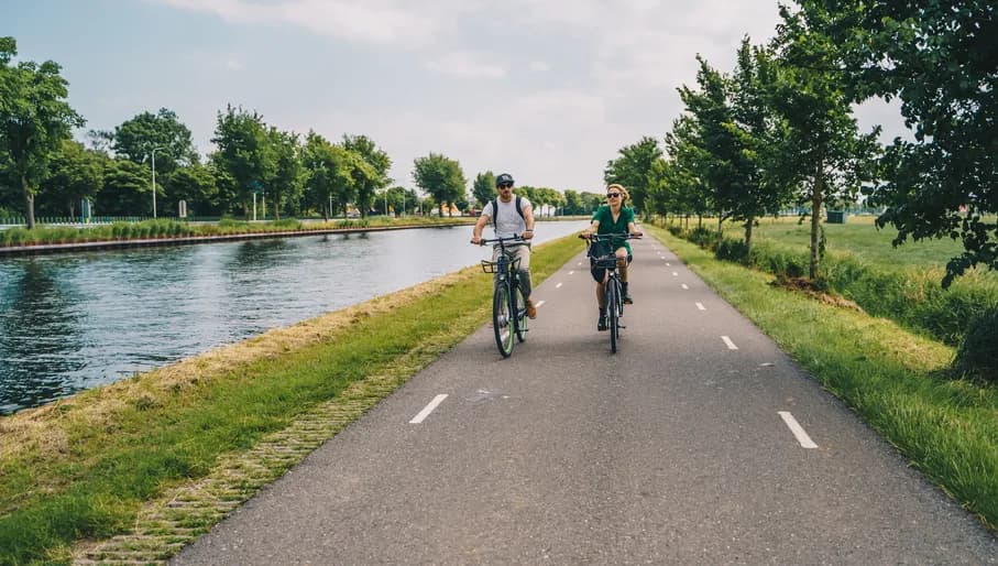 Man and woman cycling in the countryside