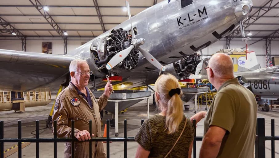 Adults looking at an exhibit at Aviodrome Museum in Lelystad