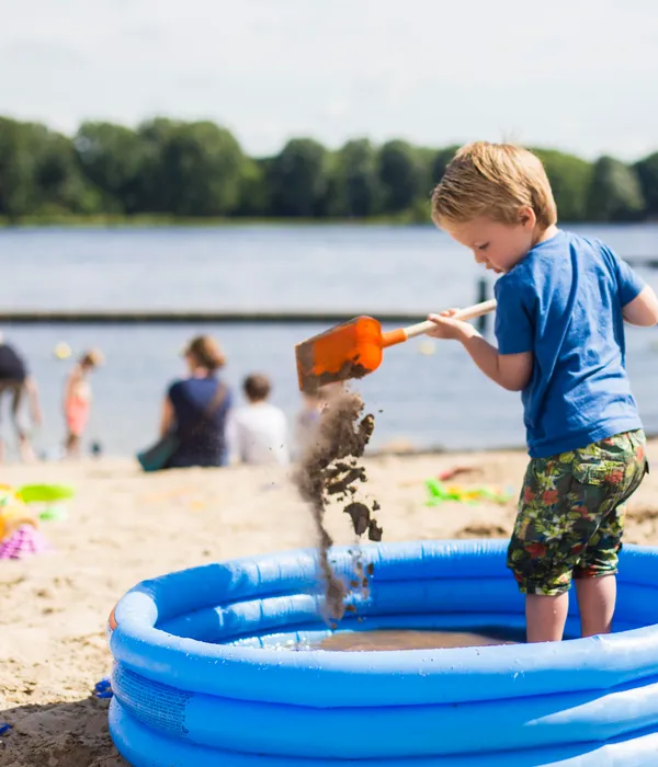 Beach Sloterplas, child playing on the beach