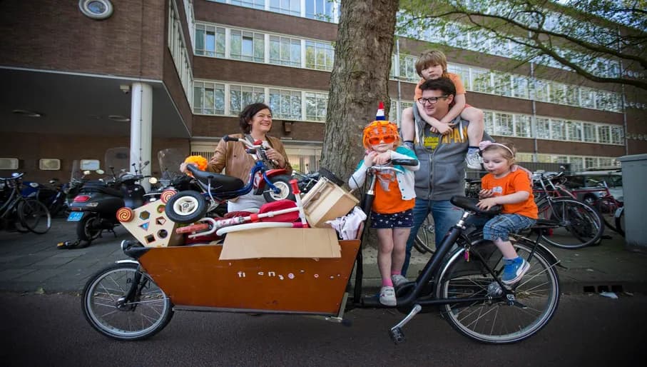 Koningsdag or King's Day is a national holiday in the Kingdom of the Netherlands. Celebrated on 27 April, the date marks the birth of King Willem-Alexander.
Celebrations: Kings day family with a cargo bike wearing orange costumes, flea markets.